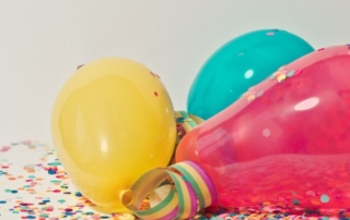 balloons and confetti on ground